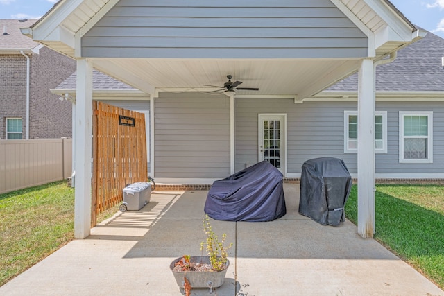 view of patio featuring fence, grilling area, and a ceiling fan