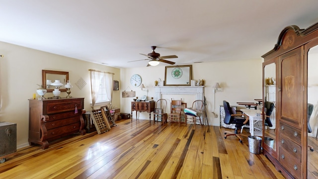 interior space featuring light hardwood / wood-style floors and ceiling fan