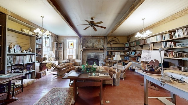 sitting room with beamed ceiling, ceiling fan, dark hardwood / wood-style floors, and a fireplace