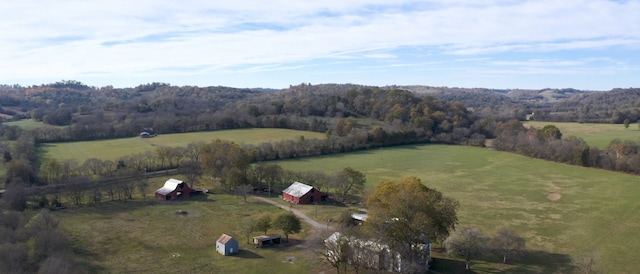 birds eye view of property with a rural view