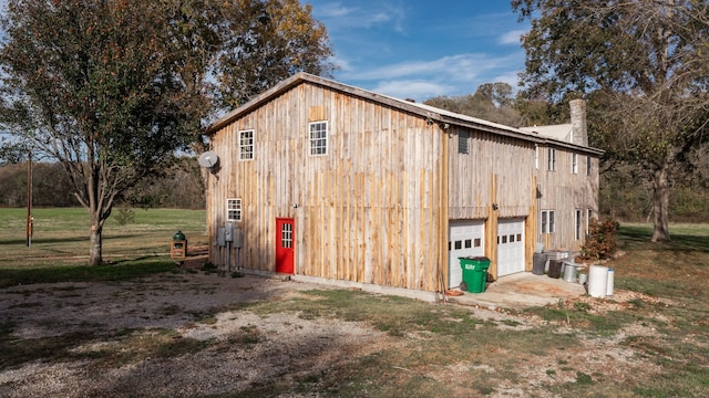 view of outdoor structure with a yard