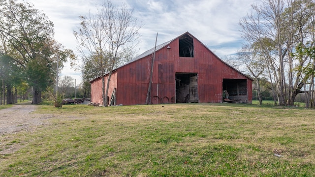 view of outbuilding with a lawn