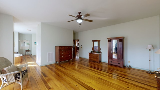 interior space with light wood-type flooring and ceiling fan