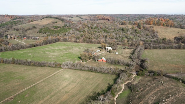 birds eye view of property with a rural view