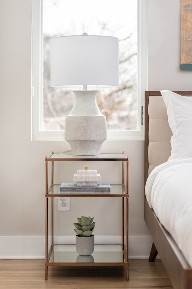 bedroom featuring light wood-type flooring and multiple windows