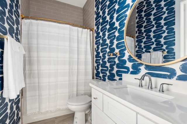 bathroom with vanity, toilet, and a shower with curtain