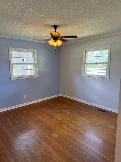 unfurnished room featuring a textured ceiling, dark hardwood / wood-style floors, ceiling fan, and plenty of natural light