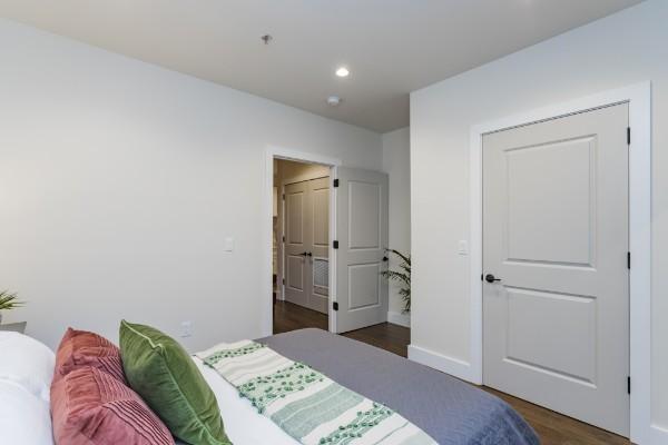 bedroom featuring dark wood-type flooring