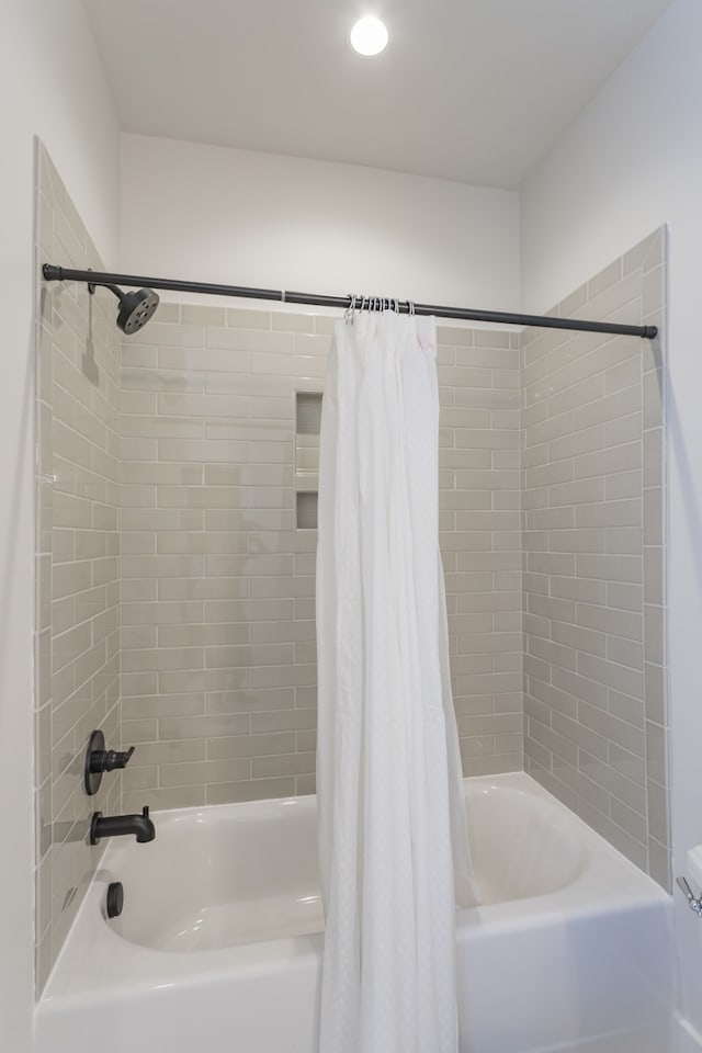 bathroom featuring shower / bath combo with shower curtain