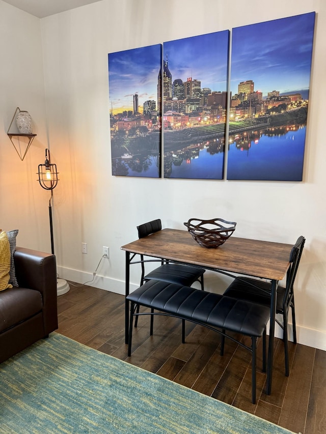 dining area featuring dark hardwood / wood-style floors