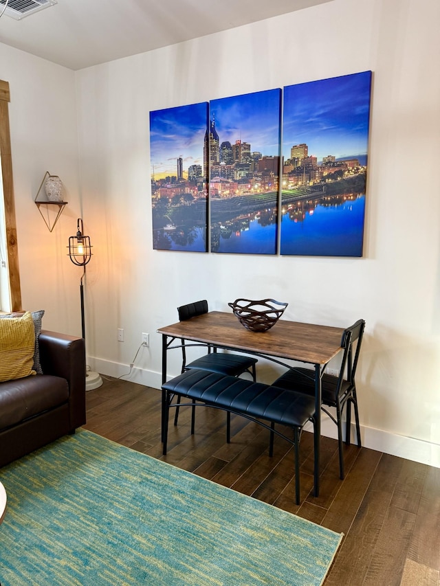 dining space featuring dark hardwood / wood-style flooring