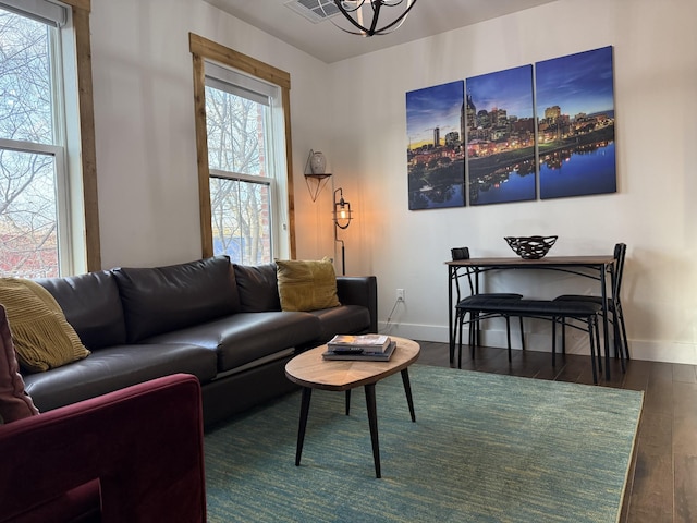 living room with dark hardwood / wood-style flooring