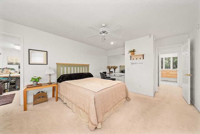 bedroom with light carpet, a textured ceiling, and ceiling fan