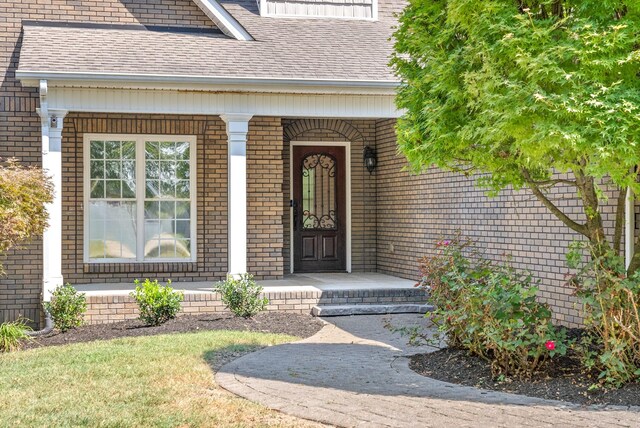 property entrance featuring covered porch