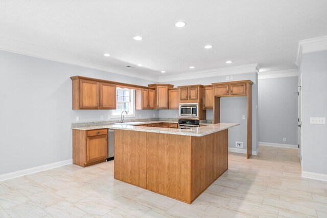 kitchen with light stone countertops, a kitchen island, stainless steel appliances, and sink