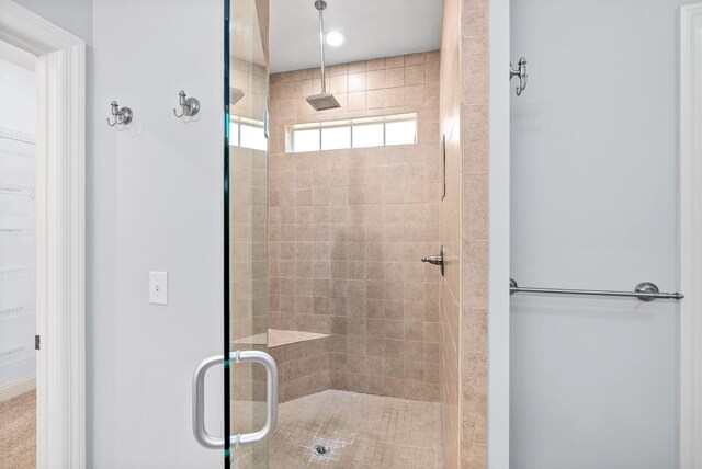 bathroom featuring walk in shower