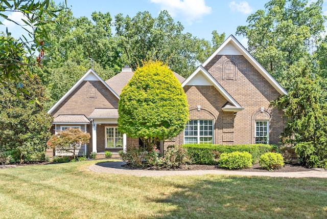 view of property featuring a front yard