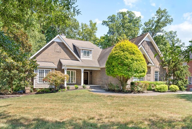 view of front of home with a front lawn