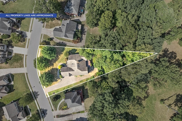 birds eye view of property with a residential view