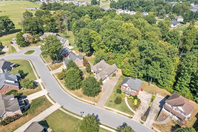 birds eye view of property with a residential view