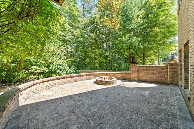 view of patio / terrace featuring an outdoor fire pit