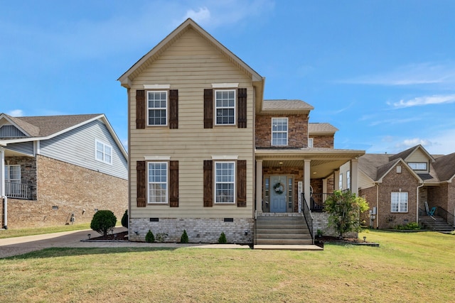 view of front facade with a porch and a front lawn