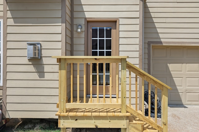 view of exterior entry featuring a garage