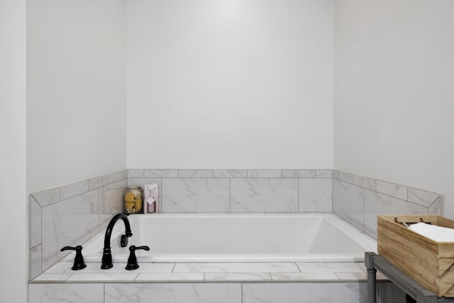 bathroom with tiled bath