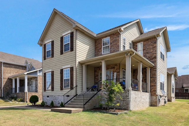 view of front of property featuring a front lawn and covered porch