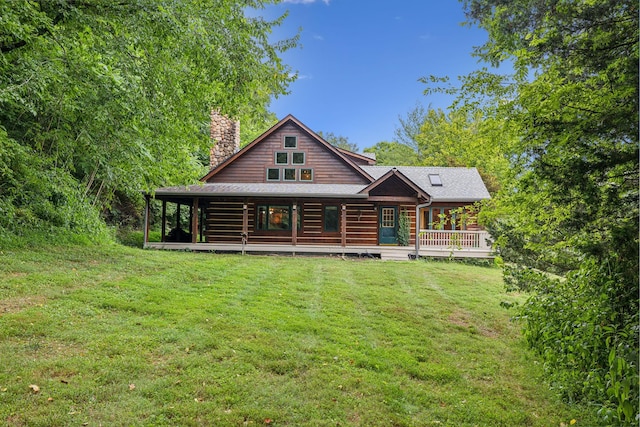 view of front of property with a front lawn and a chimney