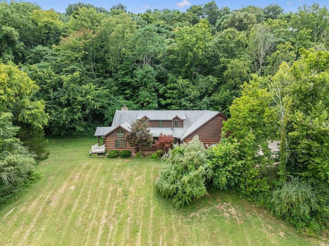 bird's eye view featuring a wooded view