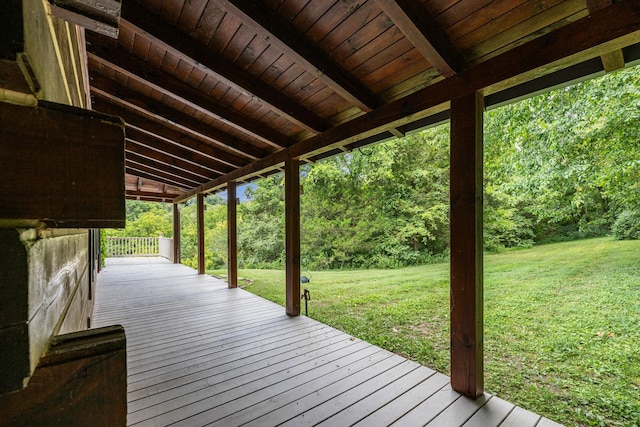 wooden deck with a lawn