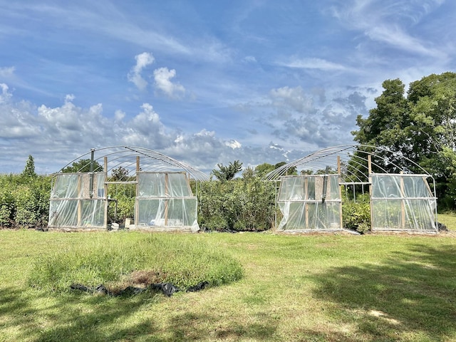 view of yard with an outbuilding and an exterior structure