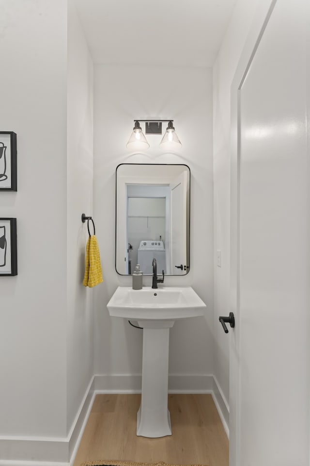 bathroom with hardwood / wood-style floors