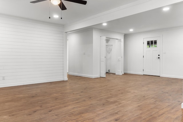 spare room featuring ornamental molding, ceiling fan, and hardwood / wood-style floors