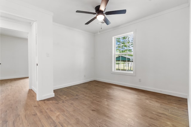 unfurnished room with light wood-type flooring, ornamental molding, and ceiling fan