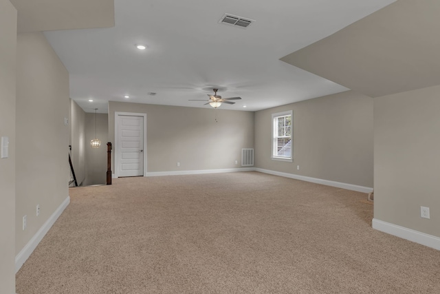 carpeted empty room featuring ceiling fan