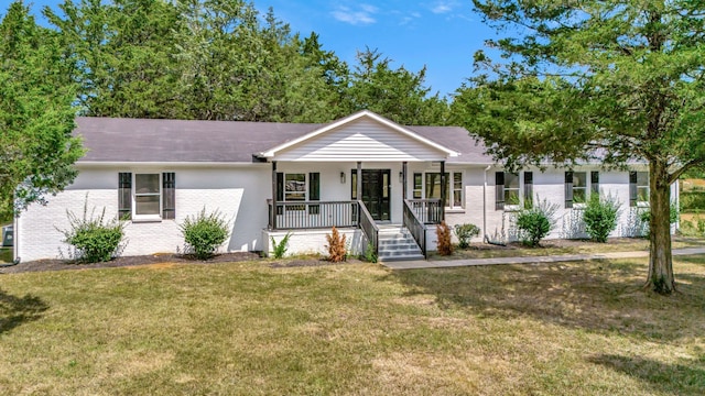 single story home featuring covered porch and a front lawn