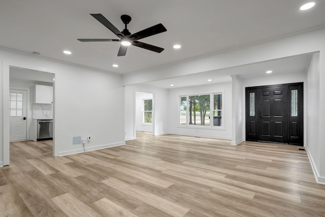 unfurnished living room with light hardwood / wood-style flooring and ceiling fan