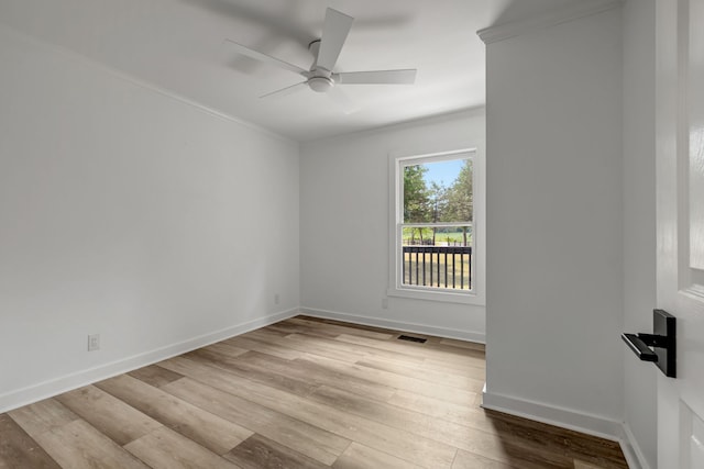 empty room featuring ceiling fan and light hardwood / wood-style floors