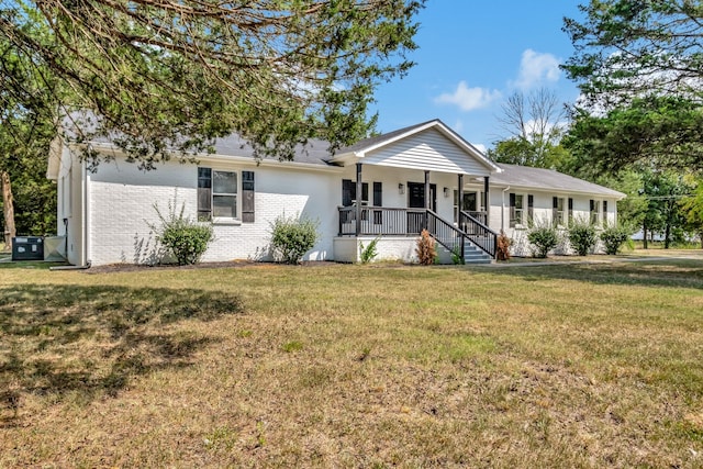 single story home with a front yard and a porch