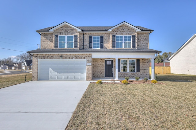 view of front facade with a garage and a front yard