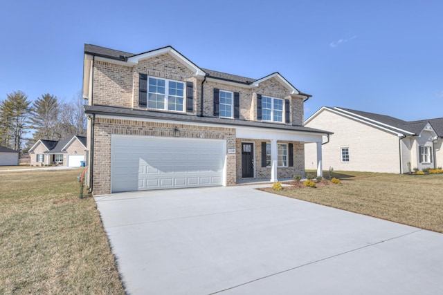 view of front facade with a garage and a front yard