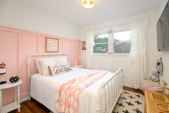 bedroom featuring dark hardwood / wood-style floors