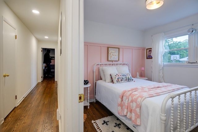 bedroom featuring dark hardwood / wood-style flooring