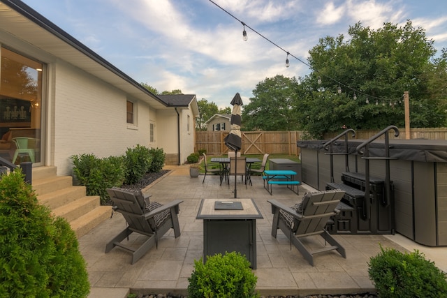 view of patio / terrace with a fire pit