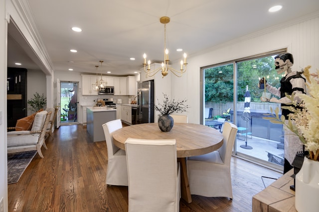 dining space with a chandelier, dark hardwood / wood-style flooring, and crown molding