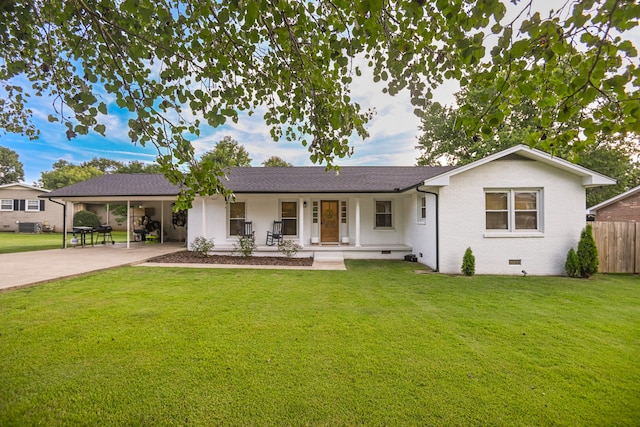 ranch-style home with covered porch and a front lawn