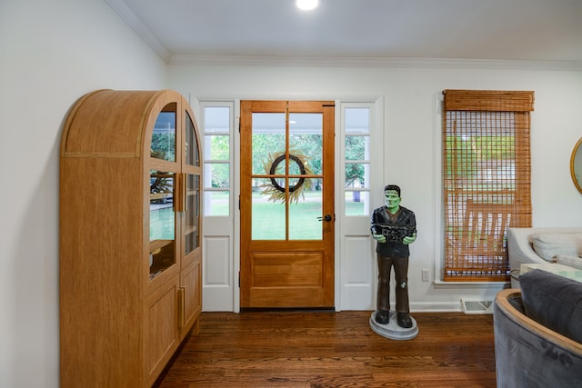 entrance foyer featuring dark hardwood / wood-style floors and ornamental molding