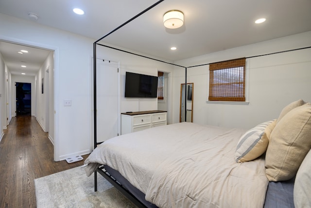 bedroom featuring dark wood-type flooring